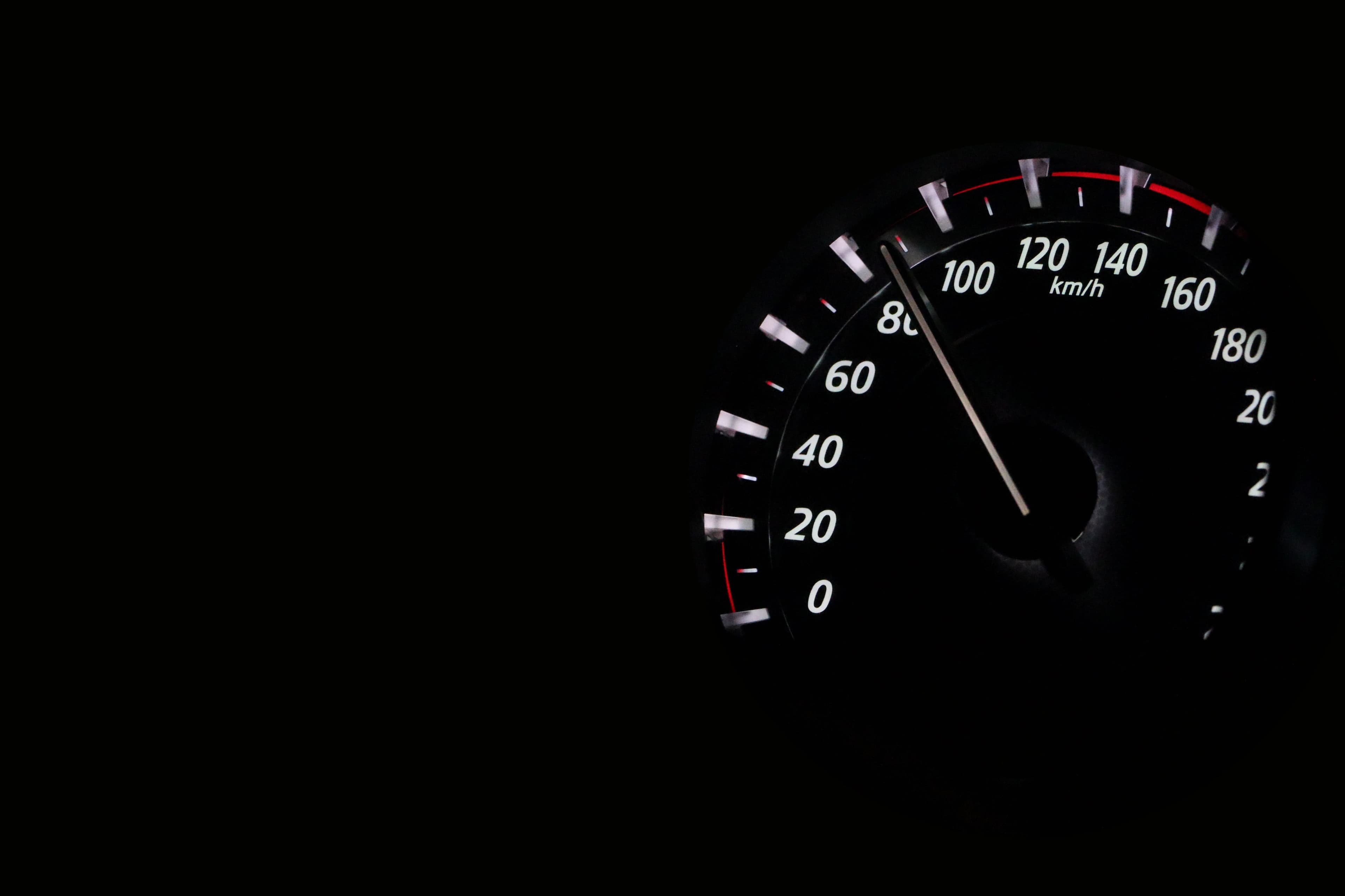 Dashboard speedometer showing a car accelerating